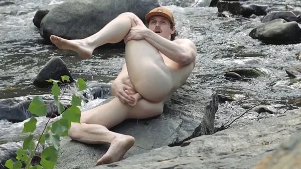 Tom The Cowboy uses a dildo by the river and then cums